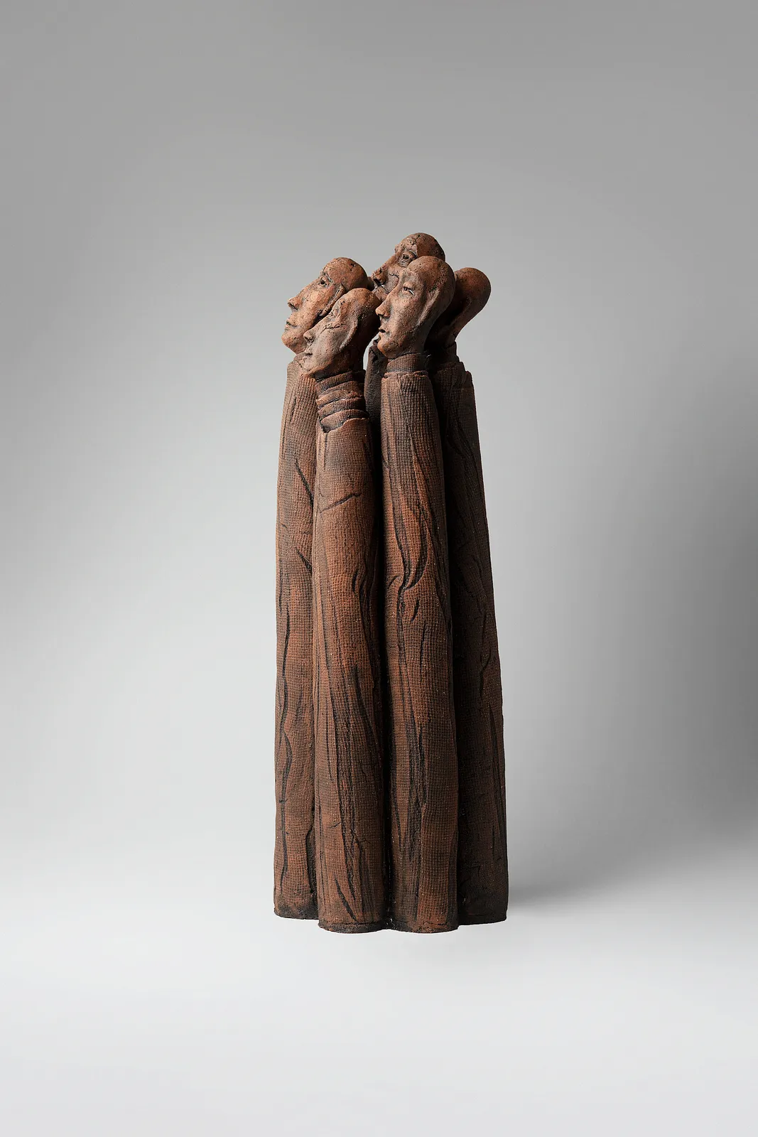 Image of One whole by Liudmyla Davydenko, size: 49x18x15, made of chamotte, glaze, Sculpture medium, part of the Holova/Head series, priced at €1000 Photo 2 of 4.