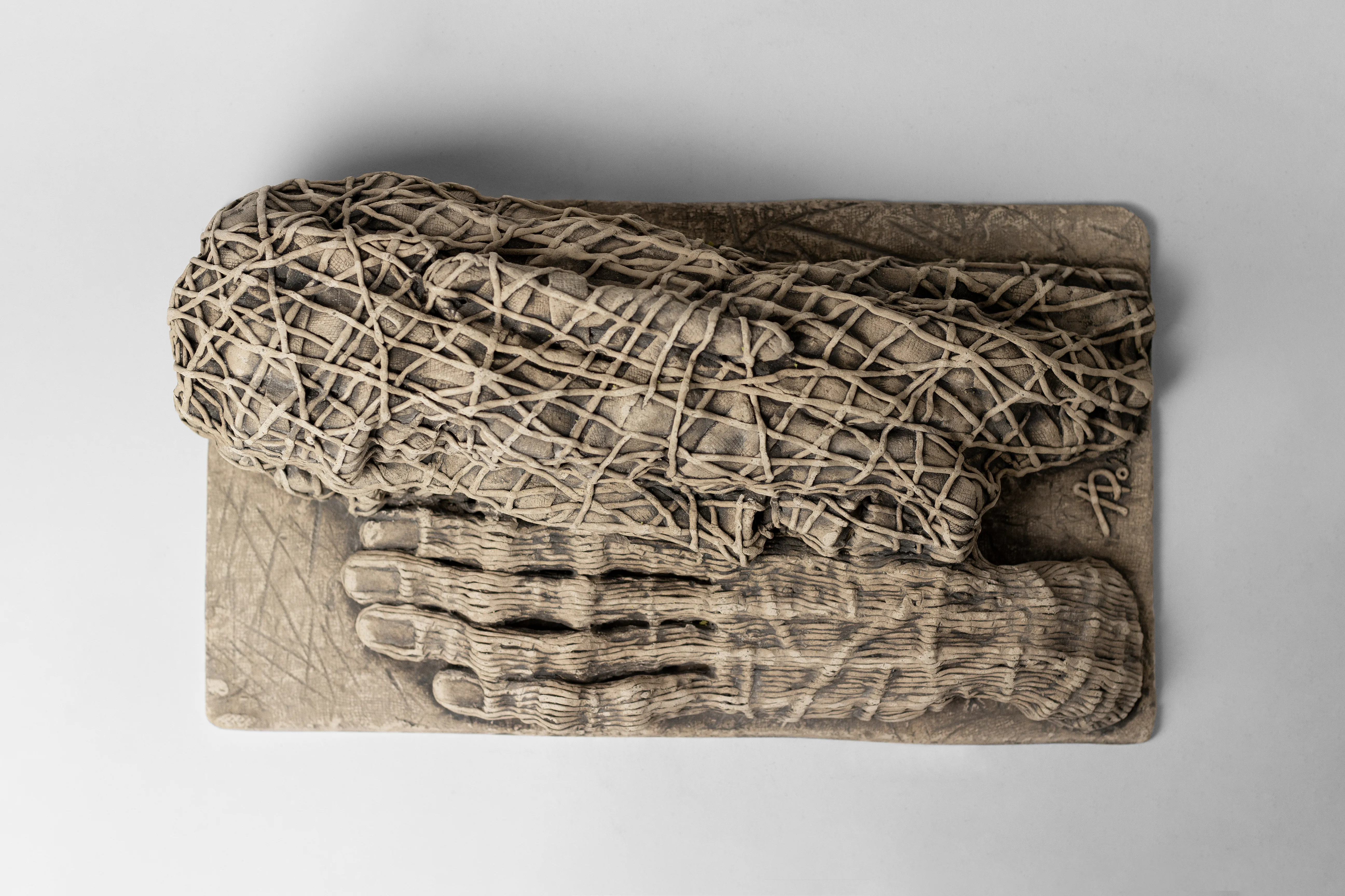 Image of The one who lying down by Liudmyla Davydenko, size: 38х21х12, made of chamotte, glaze, Sculpture medium, part of the Holova/Head series, priced at €1000 Photo 2 of 3.