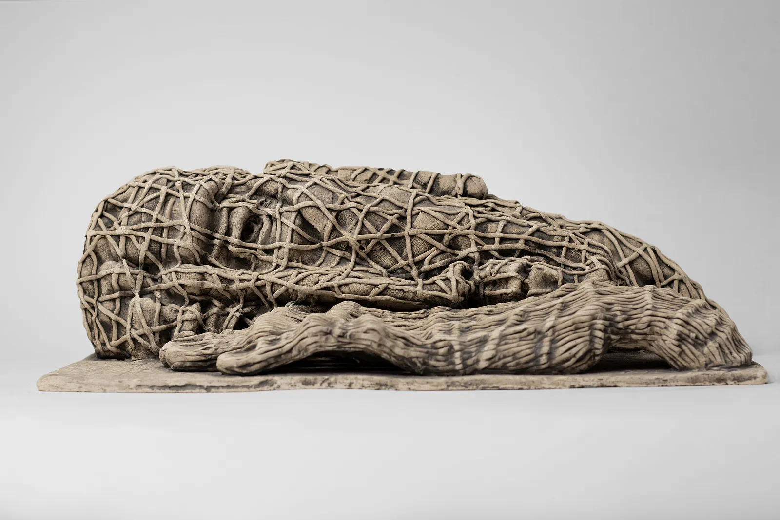 Image of The one who lying down by Liudmyla Davydenko, size: 38х21х12, made of chamotte, glaze, Sculpture medium, part of the Holova/Head series, priced at €1000 Photo 3 of 3.