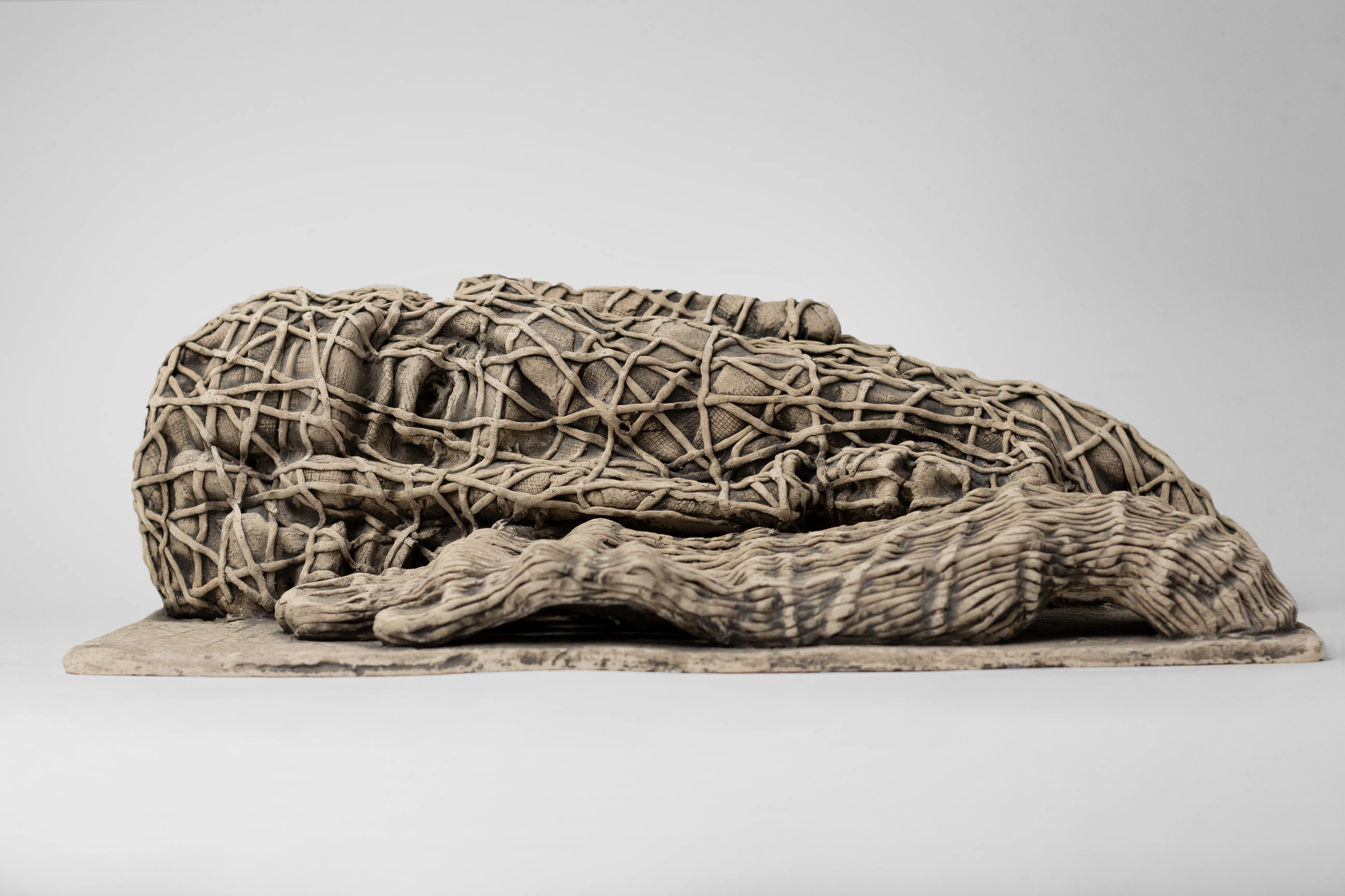 Image of The one who lying down by Liudmyla Davydenko, size: 38х21х12, made of chamotte, glaze, Sculpture medium, part of the Holova/Head series, priced at €1000 Photo 3 of 3.